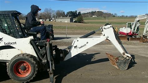 youtube skid steer backhoe|bobcat with backhoe attachment.